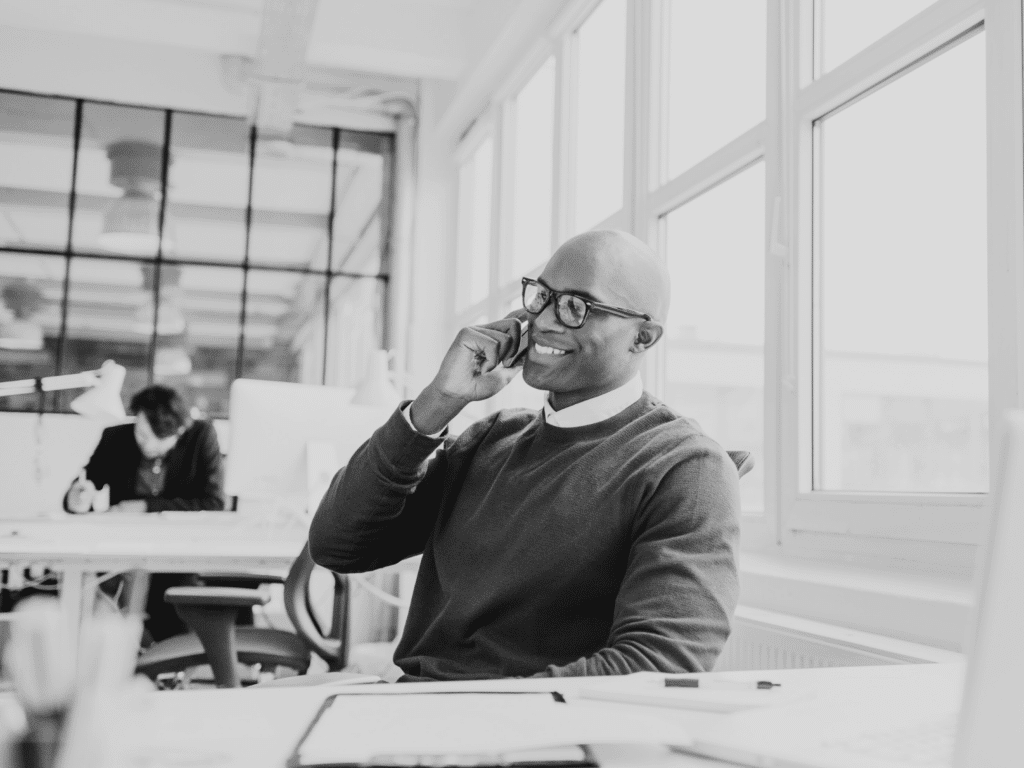 man talking on the phone at desk